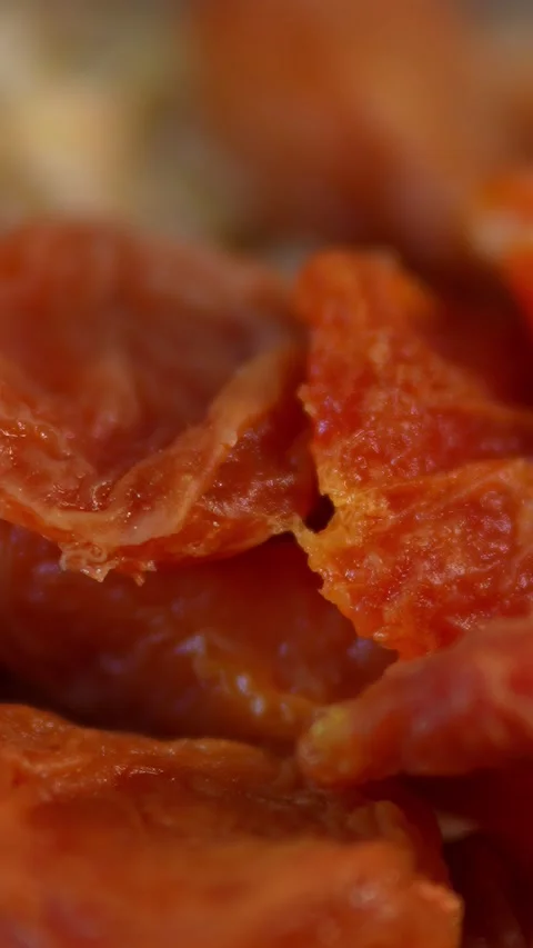 An extreme macro close-up of dried apricot pieces Stock Footage 328804279