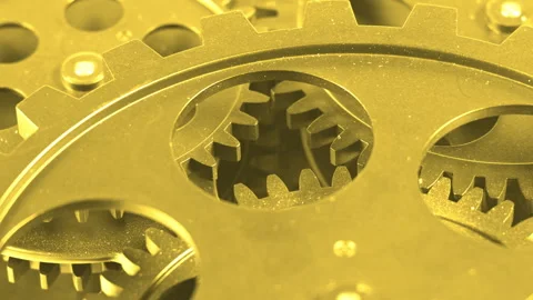 Extreme Macro Close-Up of Golden Interlocking Metal Gears Stock Footage 340531208