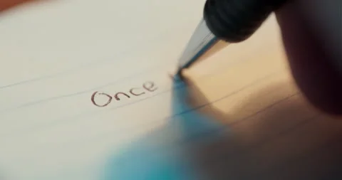 Extreme Macro Close Up Of Hand Writing Once Upon A Time On Paper Stock Footage 336436959