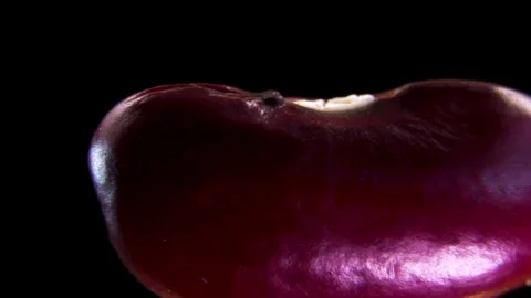 Extreme macro close up of raw red kidney beans heap rotating on dark background Stock Footage 338126786