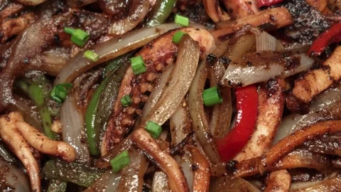 Extreme macro close-up of spicy stir-fried squid tentacles Stock Footage 344744745