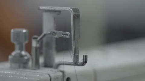 Extreme Macro Closeup of Industrial Sewing Machine Thread Hook and Guide Stock Footage 332920863