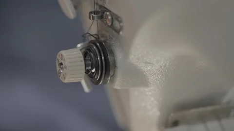 Extreme Macro Closeup of Sewing Machine Tension Dial and Thread Mechanism Stock Footage 332948779