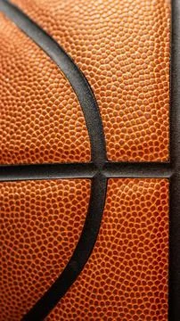 Extreme macro cropped background view of a classic orange leather basketbal.. Stock Photos