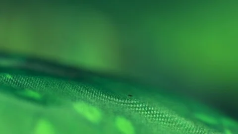Extreme macro Green tie dye textile fabric rack focus Stock Footage