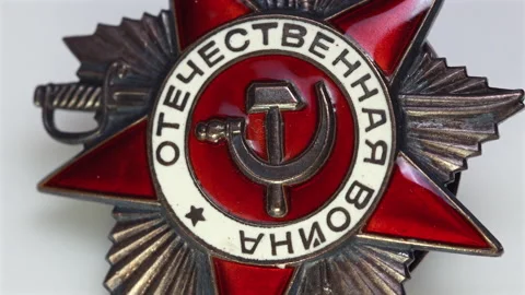 Extreme macro pan over Soviet Order of Patriotic War medal details 스톡 동영상 334078100