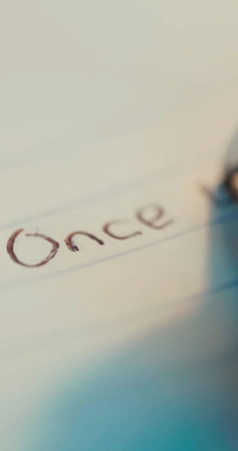 Extreme Macro Of Pen Writing Once Upon A Time On Lined Paper Stock Footage 336436766