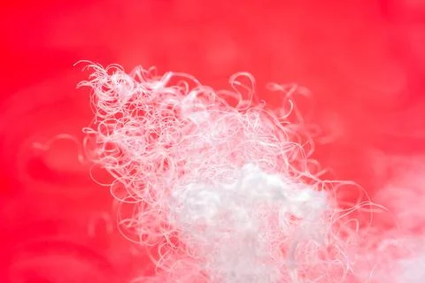 Extreme macro of polyester stable fiber on red background Stock Photos