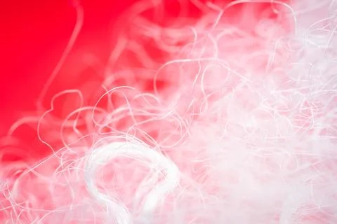 Extreme macro of polyester stable fiber on red background Stock Photos