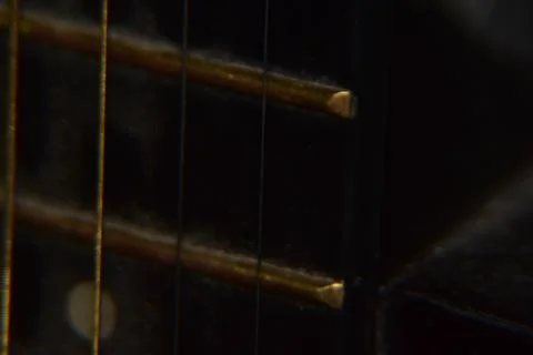 Extreme macro shot of instrument strings of acoustic guitar. 스톡 사진