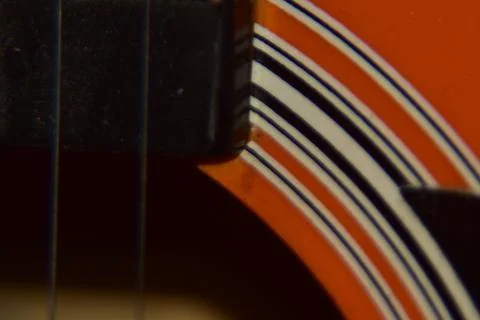 Extreme macro shot of instrument strings of acoustic guitar. Stock Photos