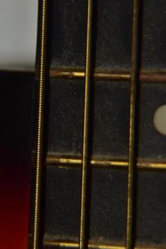 Extreme macro shot of instrument strings of acoustic guitar. Stock Photos