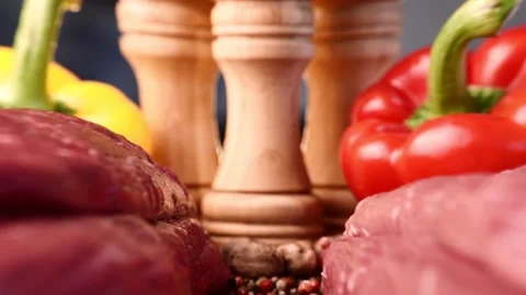 Extreme macro shot of slide between two raw beef fillets on wooden board with Stock Footage 151361266