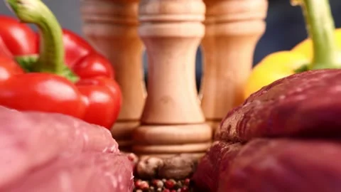 Extreme macro shot of slide between two raw beef fillets on wooden board with Stock Footage 151612044