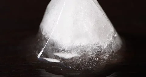 An extreme macro video of an ice cube melting Stock Footage 318211527