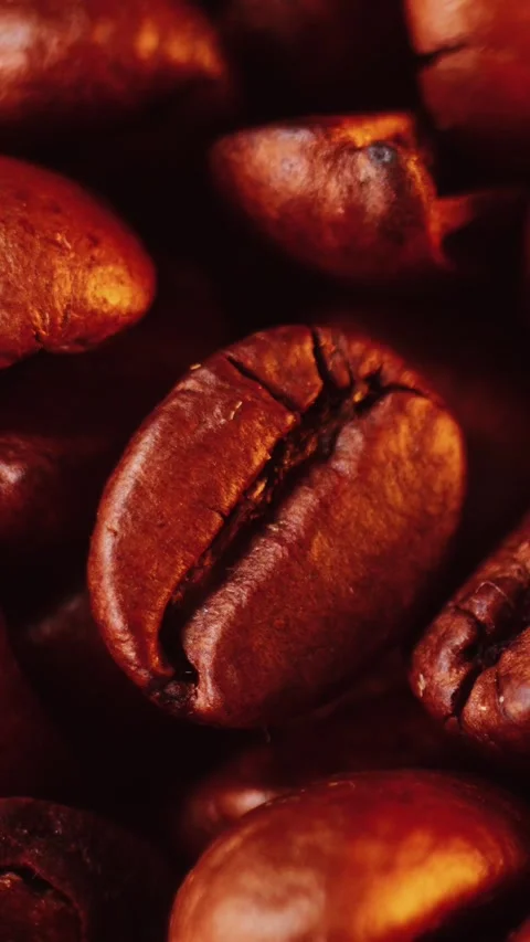 Extreme macro view of dark roasted aromatic coffee beans highlighting natur.. Stock Footage 348579719