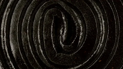 Extreme macro view with rotation of a licorice gummy candy spiral shaped. Stock Footage 170669712