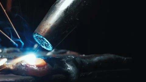 Extreme Macro of Welding Wire Melting Process with Hot Molten Steel Drop 4k Stock Footage 336729660