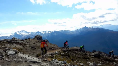 Extreme Mountain Bikers Riding Down the Mountain, 4K Stock Footage 55277273