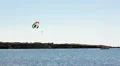 Extreme paragliding in blue sky with riding boat in Mediterranean sea, Cyprus HD Footage