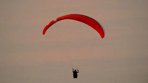 Extreme Paragliding at Sunset Stock Footage 310752154
