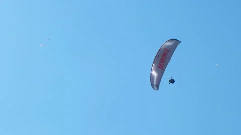 Extreme paragliding in turquoise sky. Stock-Footage 238700524