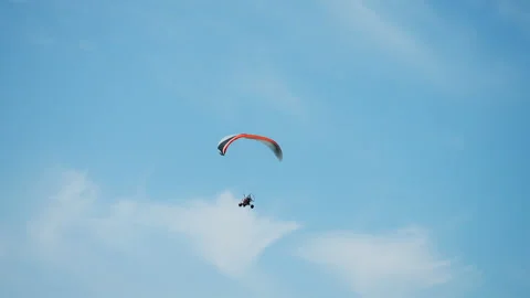 Extreme pilot paraglider flies in the clouds above the mountains. Stock Footage 312184292