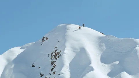 Extreme ride down of advanced freeride snowboarder from mountain summit, Chile Stock Footage 121597713