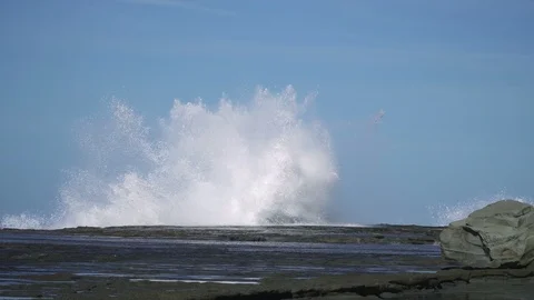 Extreme sea wave hit rock at coast with big splash Stock Footage