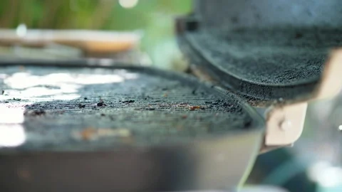 Extreme shallow depth of field on dirty Grill grate lid opens and closes twic Video stock 95031467