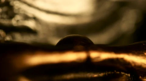 Extreme shallow focus close up of silver and golden spiritual Buddha statue Stock Footage 65764136