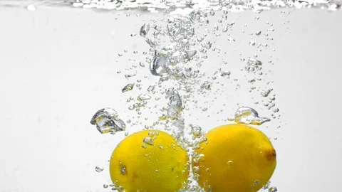 Extreme Slow Mo Of Fresh Lemons Falling Into Water Stock Footage 125989965