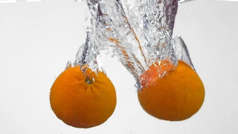 Extreme Slow Mo Of Fresh Oranges Falling Into Water Stock Footage 125991653