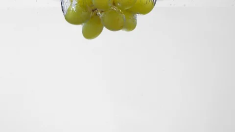 Extreme Slow Mo Of Grapes Falling Into Water Stock Footage 125990819