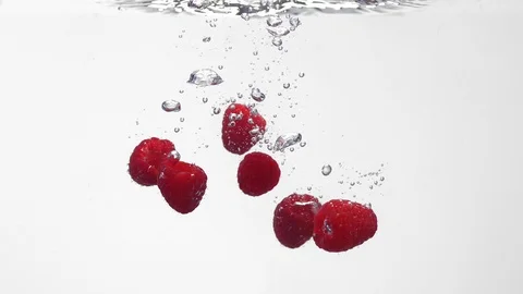 Extreme Slow Mo Of Raspberries Falling Into Water Stock Footage 125990891
