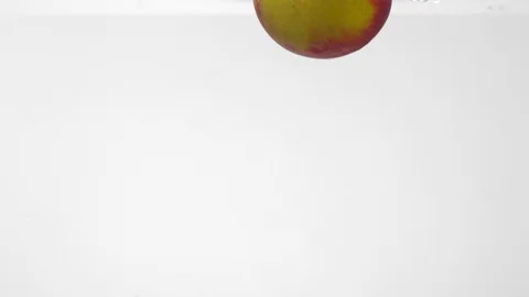 Extreme Slow Mo Of Whole Apple Falling Into Water Stock Footage 125990309