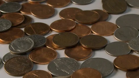 Extreme slow motion in 300 FPS of coins flipping on a table Stock Footage 117626214