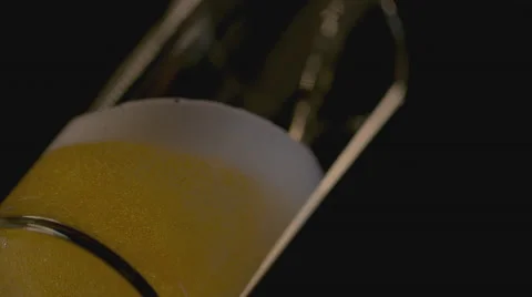 Extreme slow motion of beer being poured in the glass Video stock 58333572