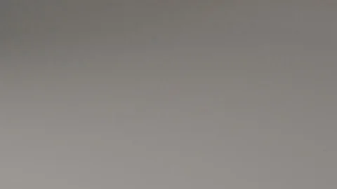 Extreme slow motion of a bunch of coins flipping on a table Stock Footage 117626721
