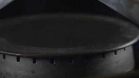 Extreme slow motion of a burning gas stove top Stock Footage 117073979