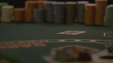 Extreme slow motion card falling on the table Stock Footage 58331498