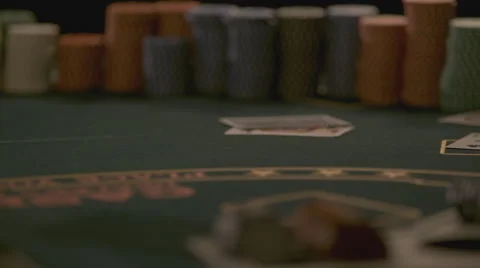 Extreme slow motion card falling on the table Stock Footage 58331613