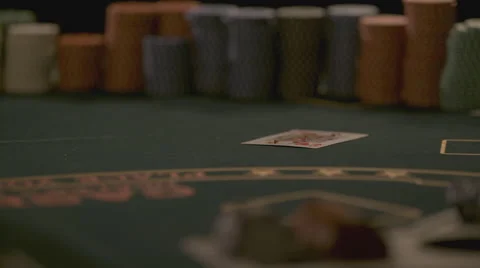 Extreme slow motion card falling on the table Stock Footage 58331643