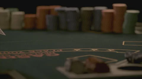 Extreme slow motion card falling on the table Stock Footage 58331655