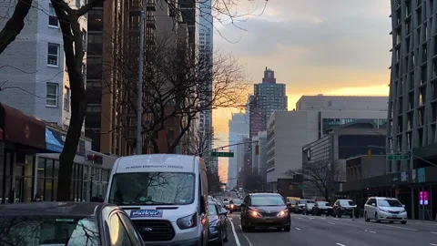 Extreme Slow Motion: Dramatic Orange sky over Manhattan 68th Street at Sunset Stock Footage 147357118