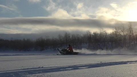 Extreme snowmobile driver creates clouds of frozen snow Stock Footage 112534370