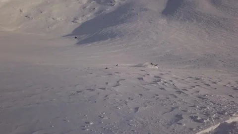 Extreme snowmobile driver makes different maneuvers Stock Footage 112537788