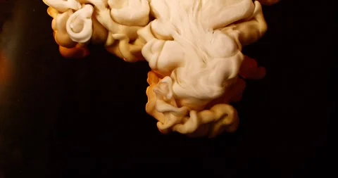 Extreme super slow motion of milk swirling and mixing into coffee Stock Footage 330360847