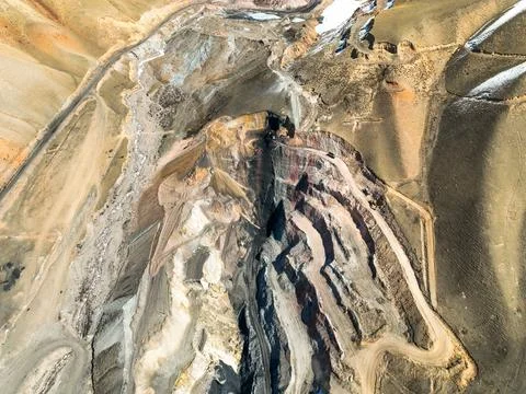 Extreme top-down abstract of open pit mine terracing and excavation Stock Photos