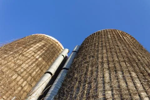 Extreme view looking up the faces of two old concrete grain silos Stock Photos